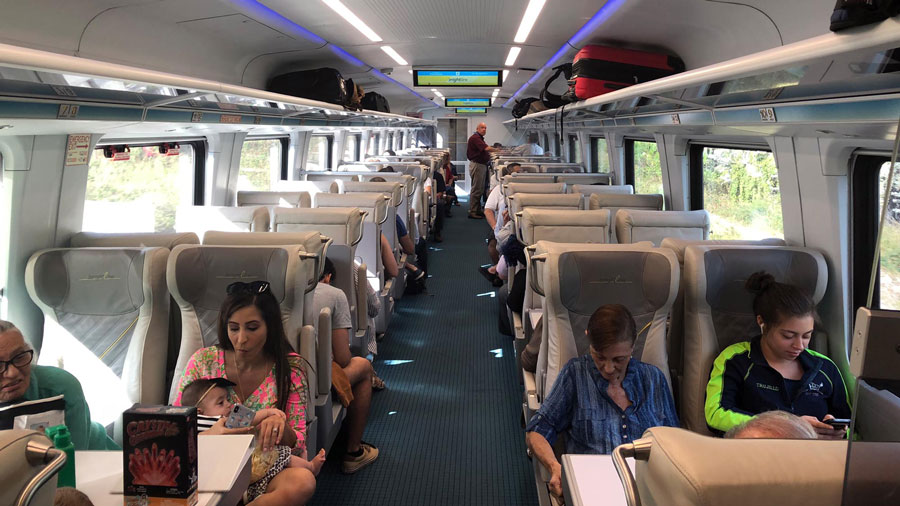 Busy interior of Brightline train