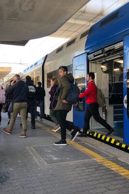 People are exiting a regional train in Rome