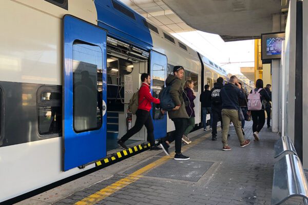 People are exiting a regional train in Rome