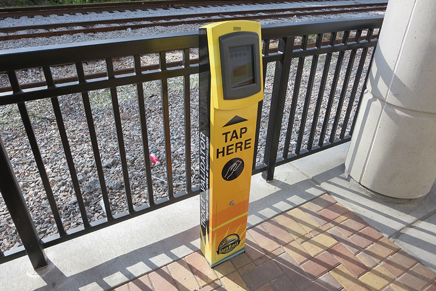A stand for tapping your credit or transit card for fare collection on Sunrail in Florida.