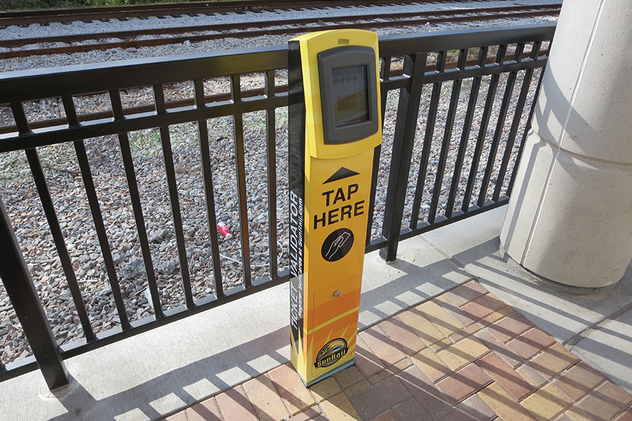 Sunrail_tapon_tapoff_900x600_Harnish A stand for tapping your credit or transit card for fare collection on Sunrail in Florida.