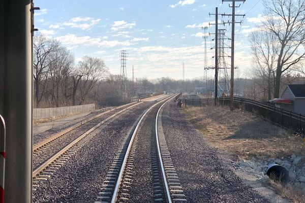 A picture taken from the back of a train after crossing the bridge at Wilmington IL