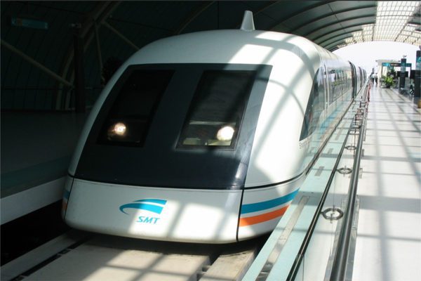 The Shanghai Maglev is in the station. You can see how the vehicle wraps around the beam.
