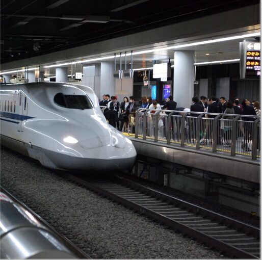 People boarding a high-speed train in Japan.