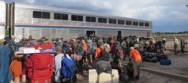 Boy Scouts are waiting to load their luggage into the baggage car at Raton, NM after hiking at Philmont Ranch.