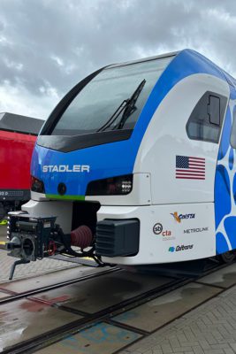 A Stadler Hydrogen powered train on display at a trade show.