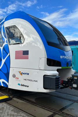 A hydrogen-powered Stadler train on dispaly at a trade show.