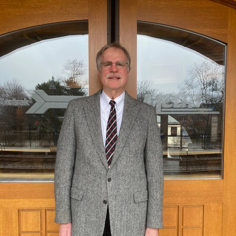 Bill Porter at doors of Glenview train station