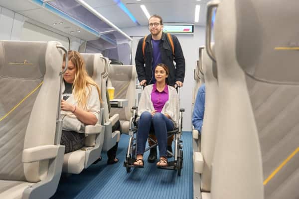 brightline interior with woman in wheelchair