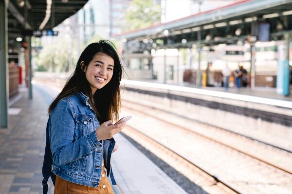smiling girl on train platform