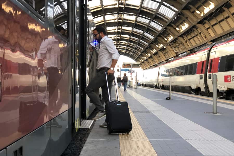 900x600 man boarding airport train