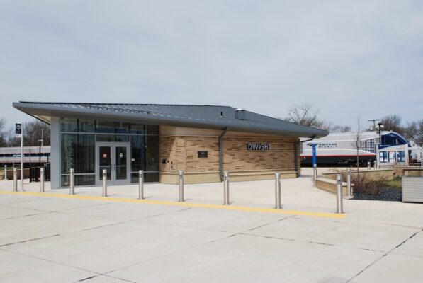 The station at Dwight IL with an Amtrak train in the background.