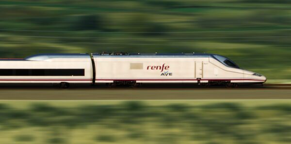 A pan shot of a talgo 350 at full speed moving from left to right.