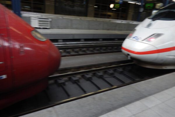 The nose of a Thalys train and the nose of an ICE train are cloe togther on the same track.