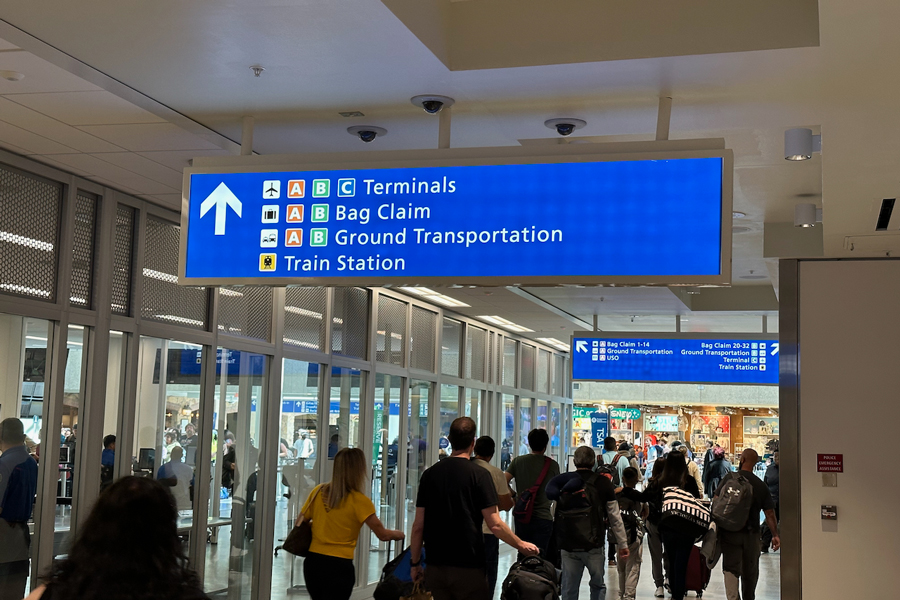 The wayfinding sign when leaving the secure area of the Orlando Airport makes it easy to find the train station.