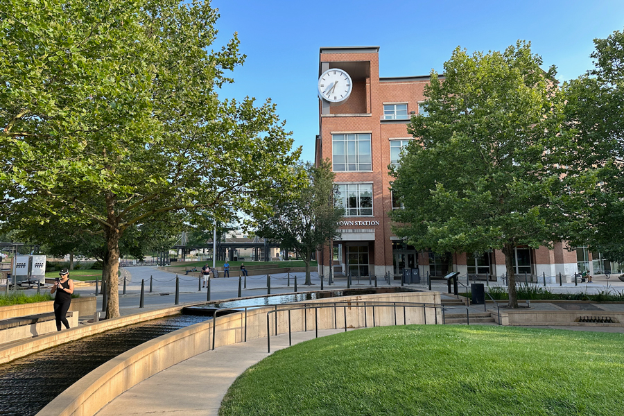 The Normal, IL station and its clock tower of the are seen with the "living plaza" in the foreground.