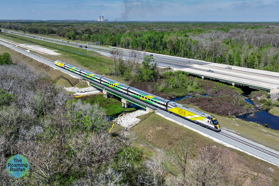 brightlin-train-at-econ-river-bridge_900x600 A Brightline train is shown running alongside Florida route 528 from above