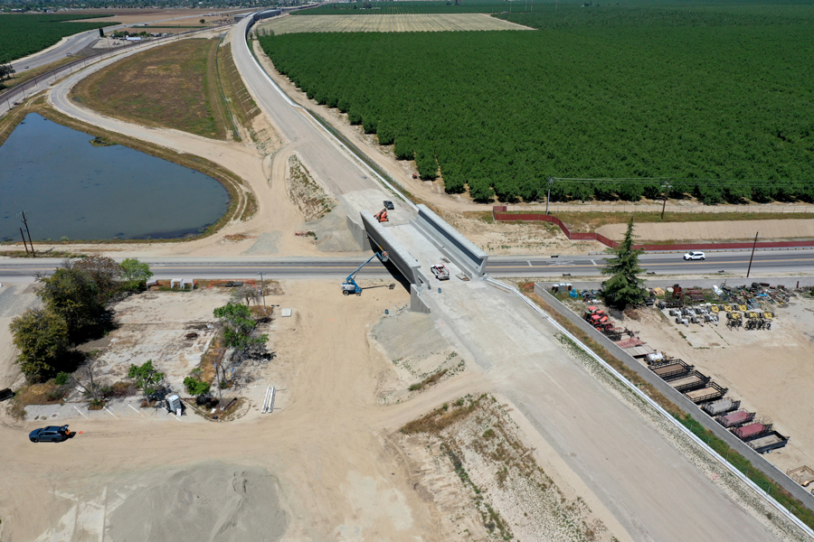 The recently completed right of way for California High speed rail is running from the upper left corner to the lower right corner. A new bridge over a road is the main subject of the picture.