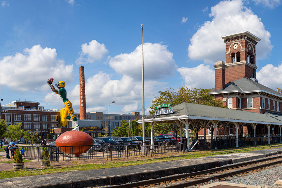 A statue of a Green Bay Packer alongside the former Green Bay train station.