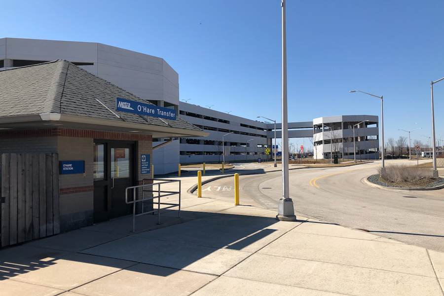 The O'Hare Transfer station is in the foreground and the ramp into an O'Hare parking garage is in the background.