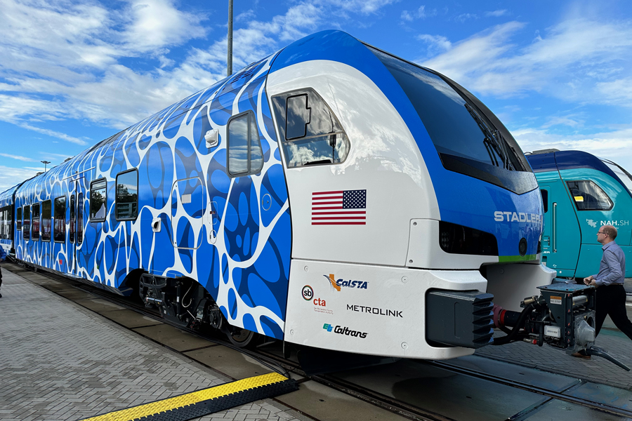 A hydrogen powered trainset on display at a trade show.