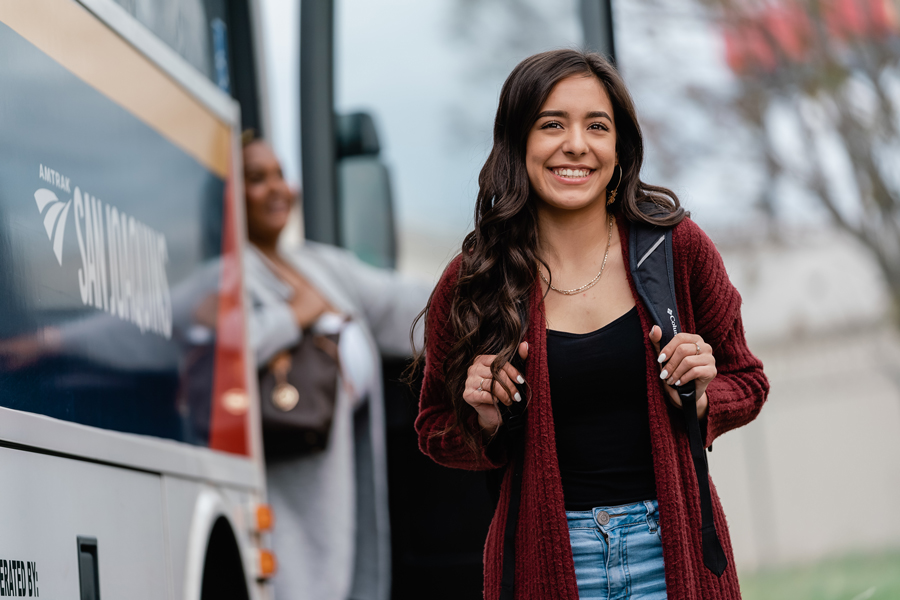 A passegner has just gotten off a bus.