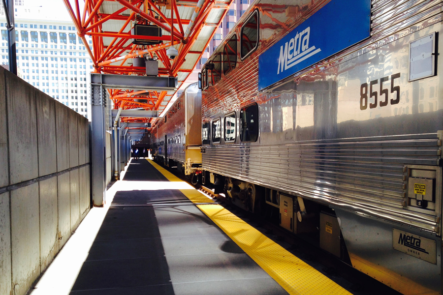 A Metra train is parked at La Salle St Station in Chicago. 