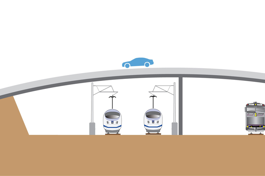 An Italo high-speed train is passing under a highway bridge.