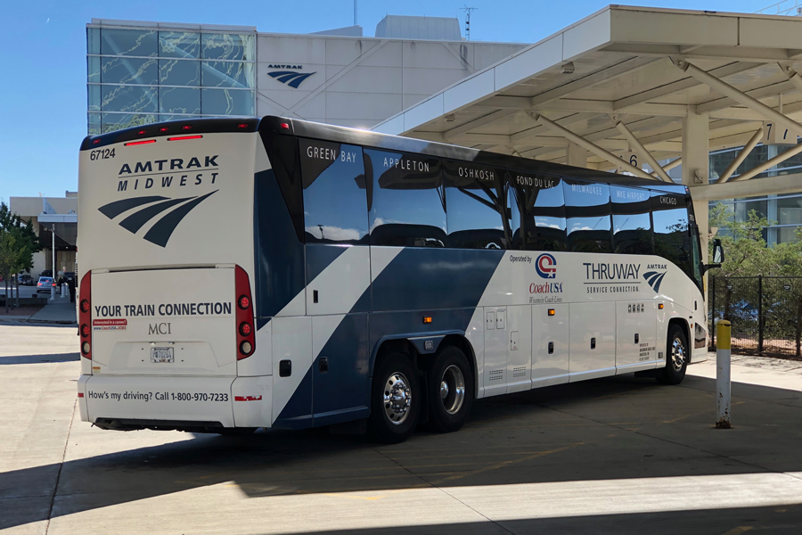 An Amtrak Midwest bus is preparing to board passengers in Milwaukee.
