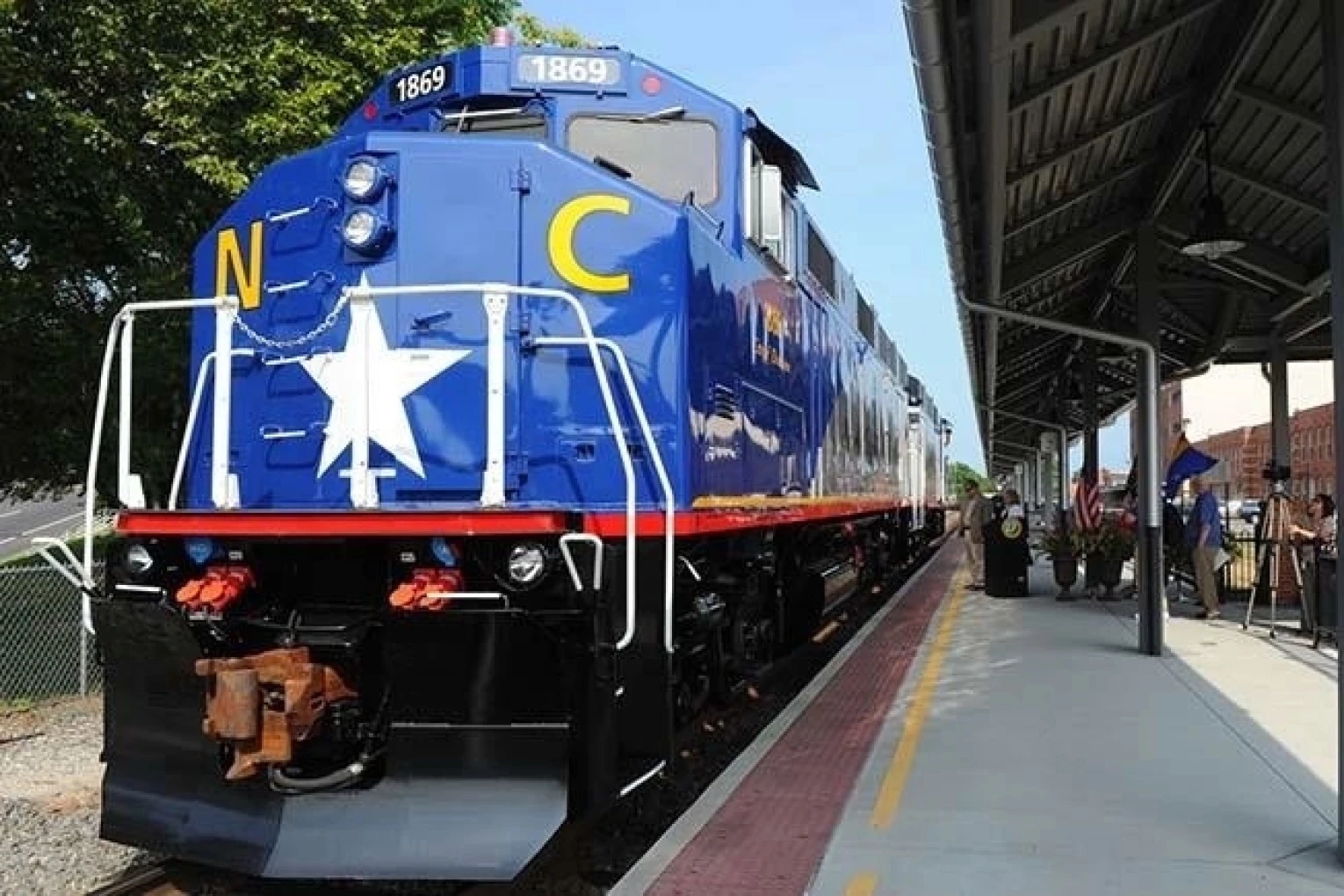 900x600 A North Carolina DOT train is pulling into the station.